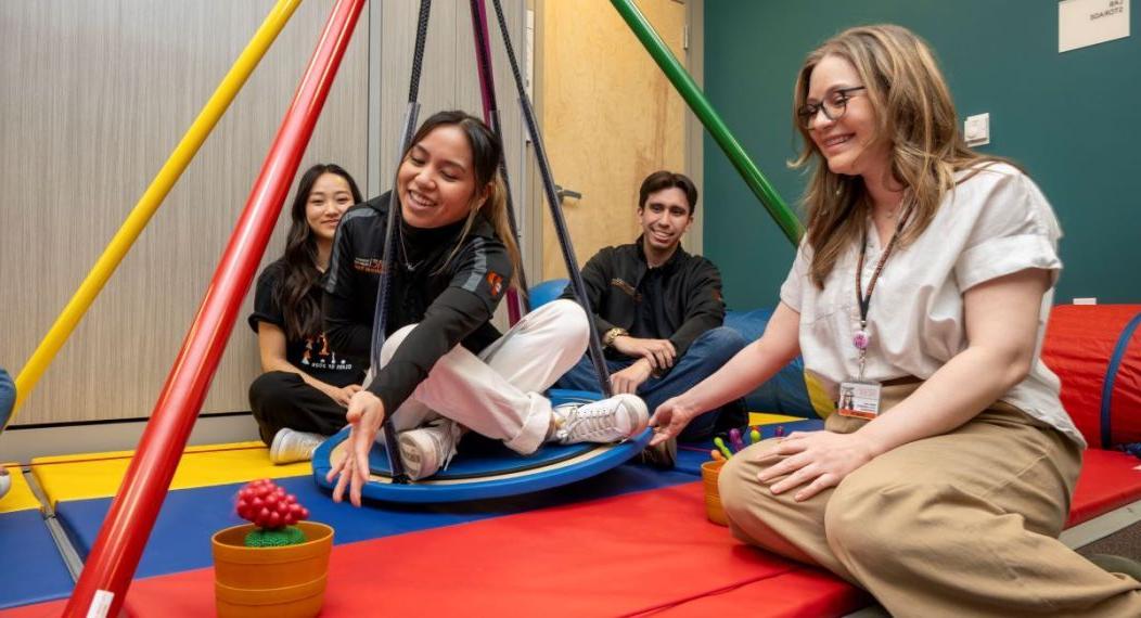 Occupational therapy students use OT tools