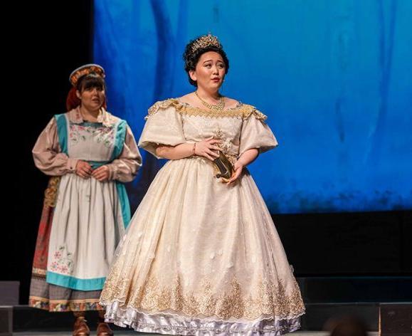 Student actor on stage as Cinderella